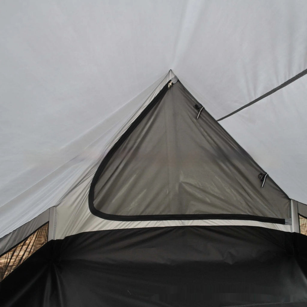 Brown or white A-frame pole-free cabin tent erected with hiking cane supports