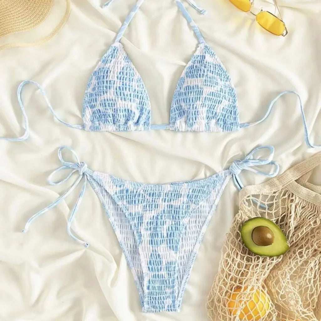 Women's floral print halter swimsuit bikini set in light blue on a mannequin