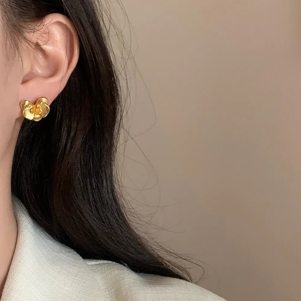 Retro flower fashion earrings for women with petal design in gold or silver electroplated finish