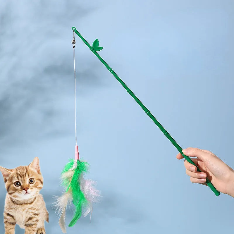 Green interactive cat feather wand toy with bells and feathers on a durable string