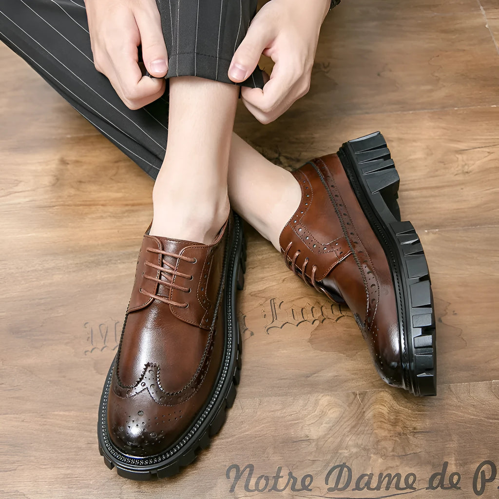 Men's black brogue leather shoes with round toe and traditional brogue detailing