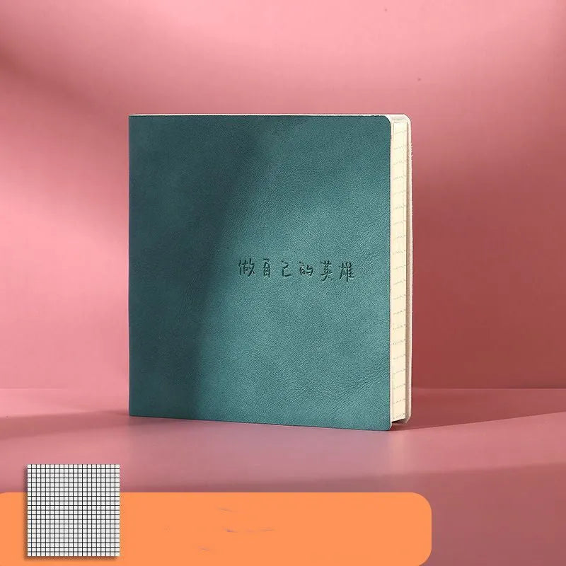 A5 square notebook with textured mesh leather cover in avocado green, showing blank internal Daolin paper.