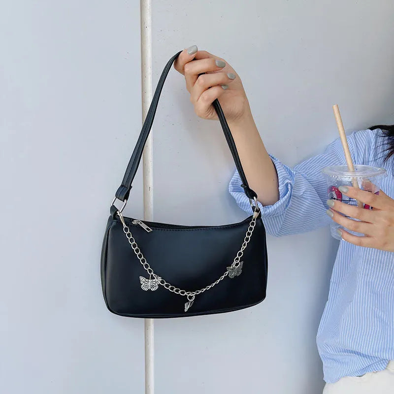 Horizontal square PU leather crossbody bag with butterfly chain detailing in light blue colour