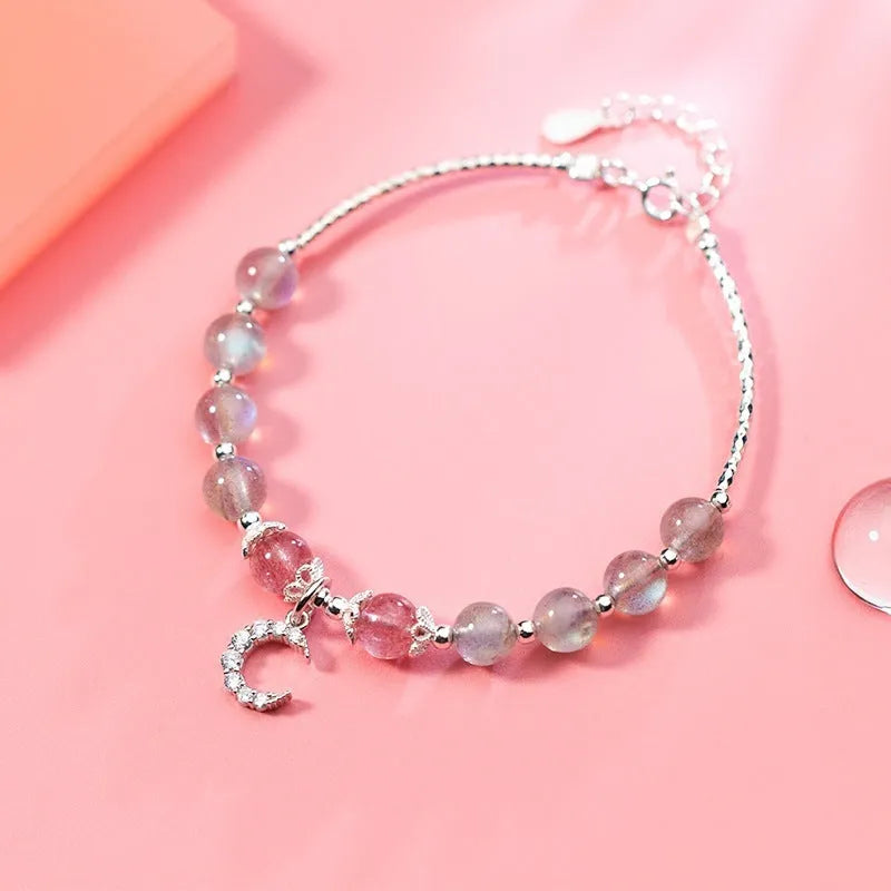 Adjustable moonstone bracelet with crescent moon charm and crystal on extension chain