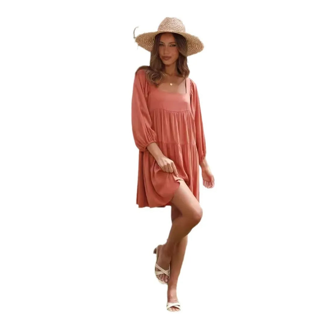 Children's orange backless pullover dress with square collar and puff sleeves showing A-line skirt silhouette
