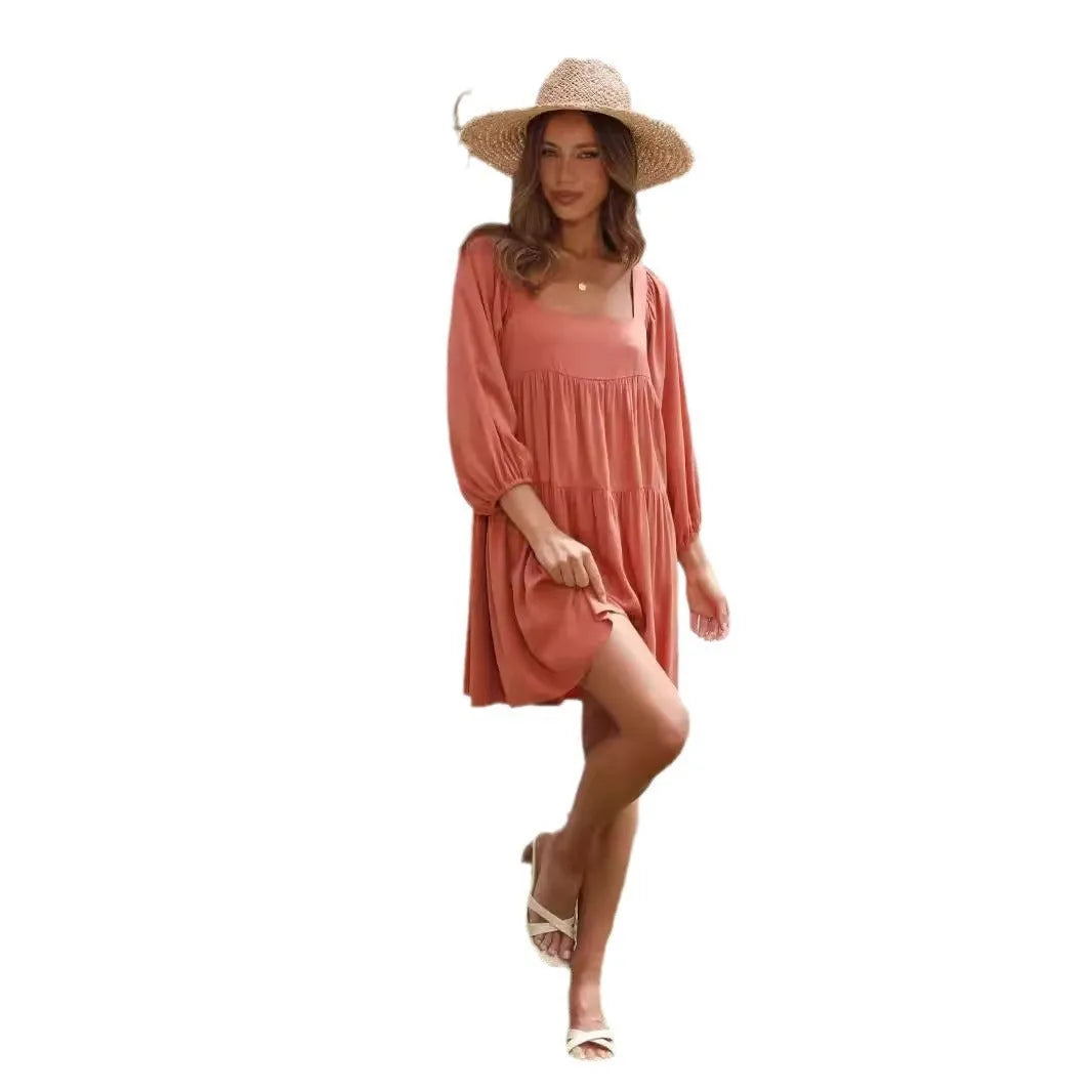 Children's orange backless pullover dress with square collar and puff sleeves showing A-line skirt silhouette