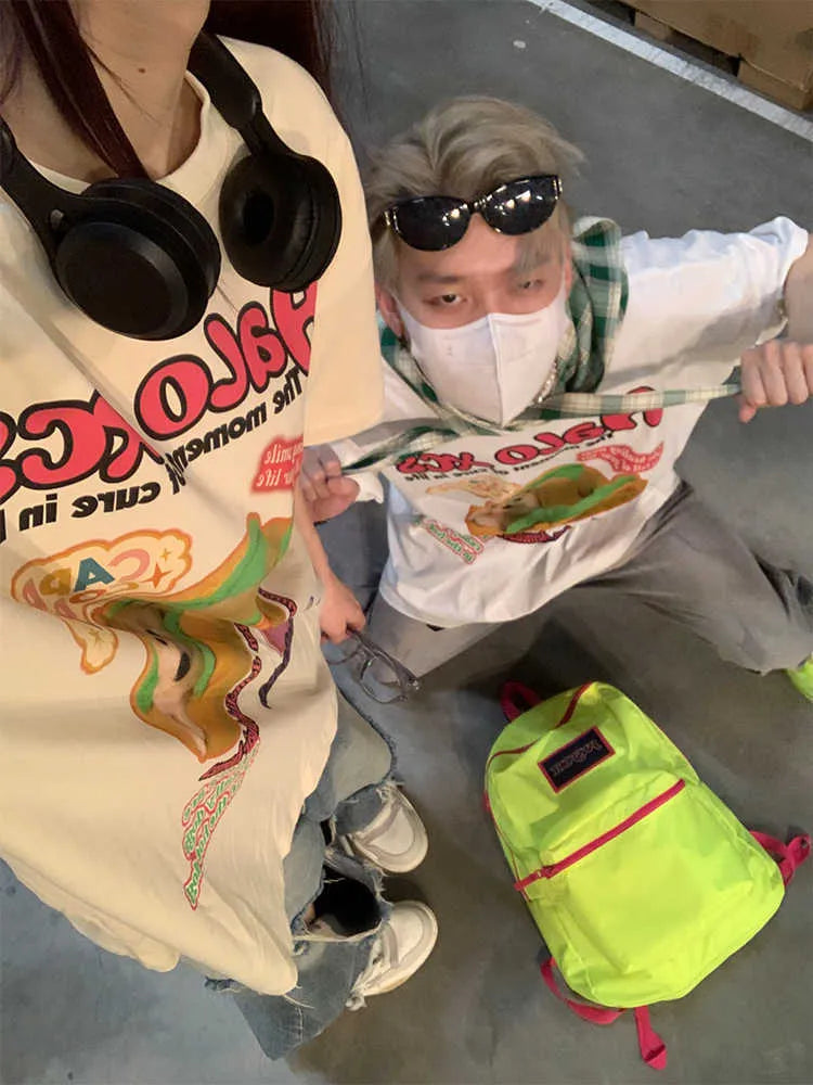 Cartoon hamburger dog printed loose-fit cotton t-shirt in apricot on a model.