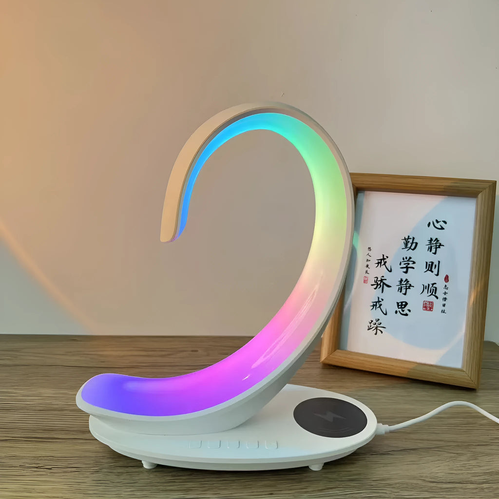 White swan shaped desktop wireless charger with Bluetooth speaker and colourful atmosphere lighting