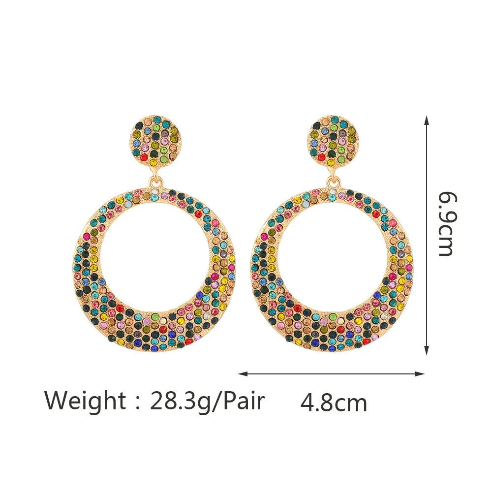 Cartoon style metal earrings with colourful diamond decorations on large round pendants