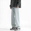 Men's light blue straight leg jeans with button waist closure on mannequin