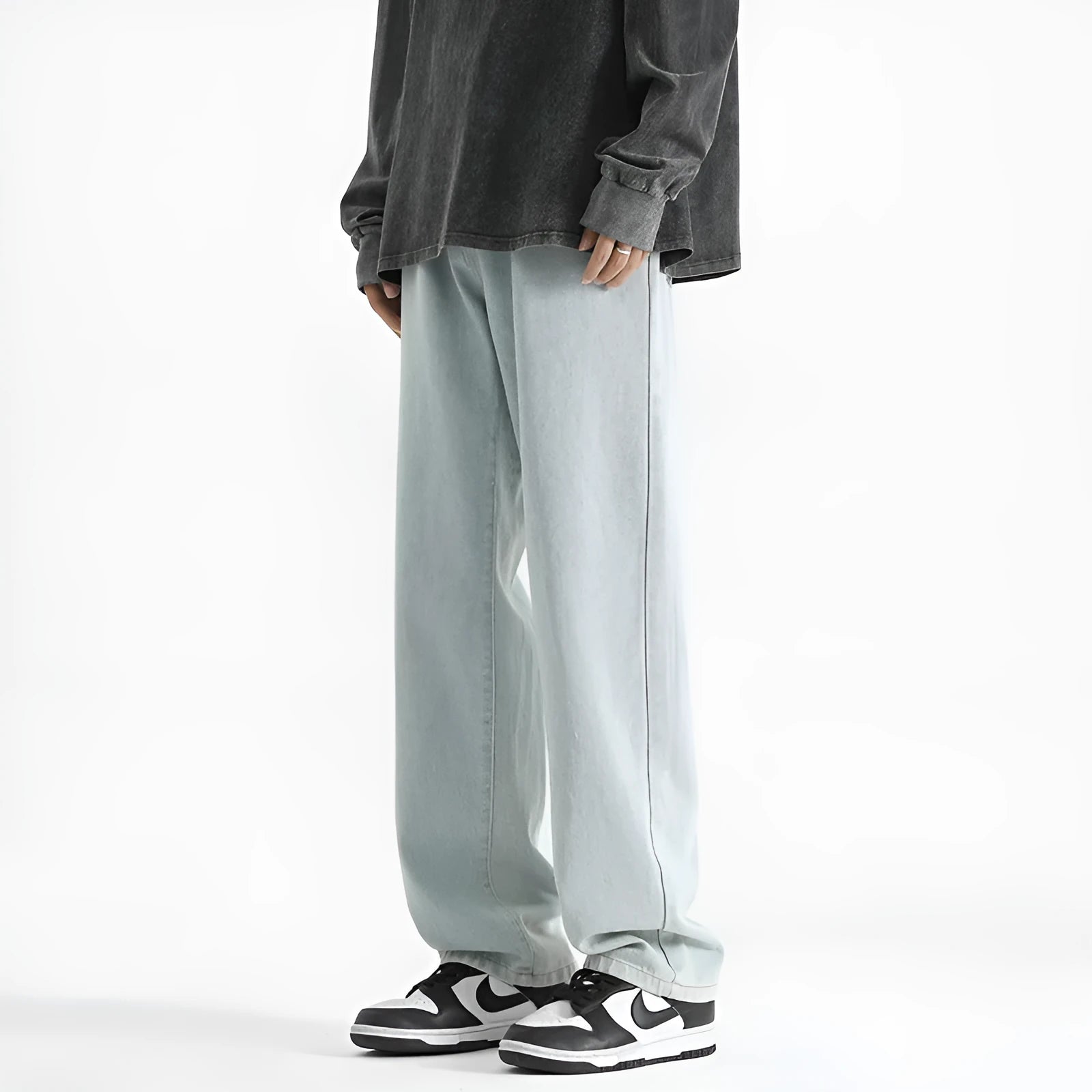 Men's light blue straight leg jeans with button waist closure on mannequin