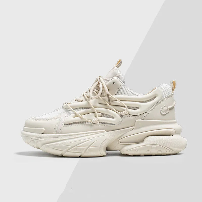Men's beige and black low-top lace-up sneakers with mesh upper and rubber platform sole.