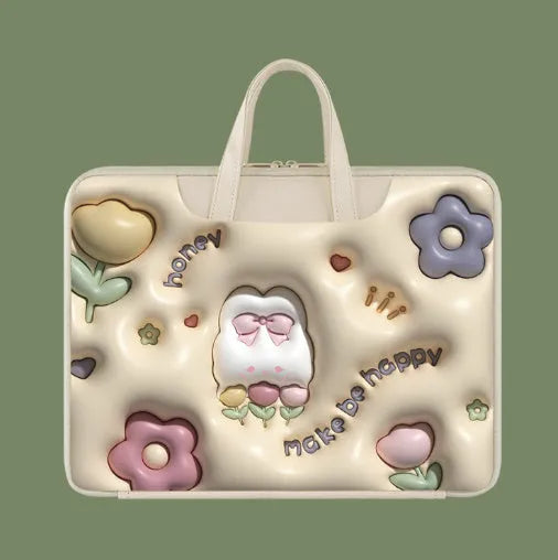 Inflatable PU leather laptop bag in a character design, shown hanging from a suitcase handle.