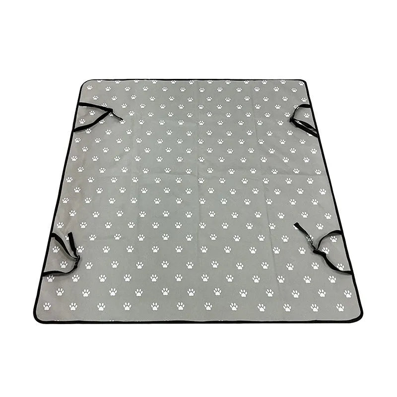 Grey dog bone print water resistant car pet mat measuring 140x110cm on a car rear seat.