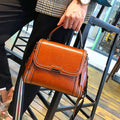 Women's genuine leather messenger bag in horizontal square design with multiple internal compartments