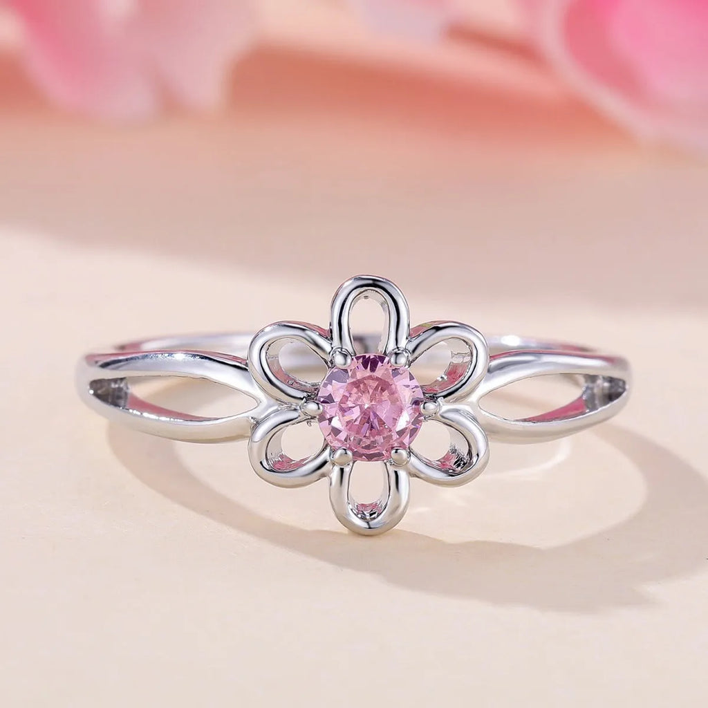 Women's hollow floral ring made from copper with electroplated finish in platinum pink diamond colour