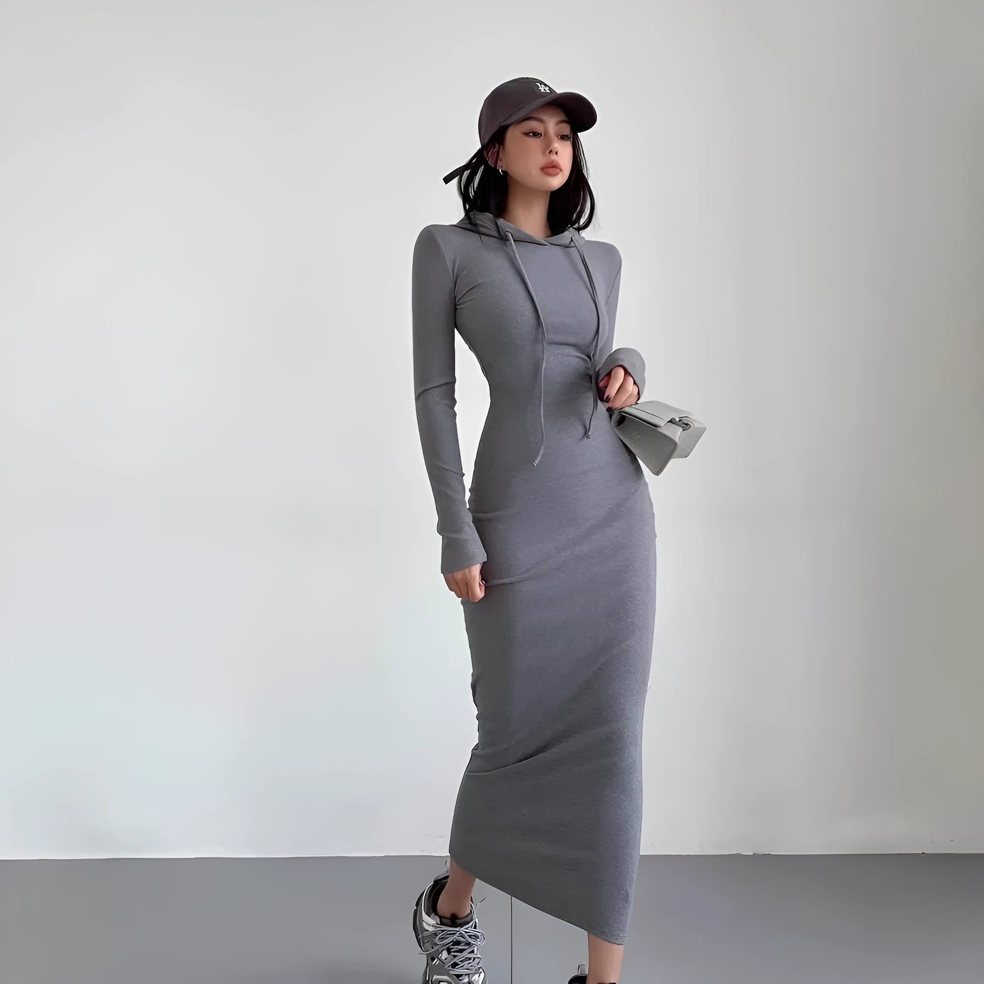 Women's long sleeve hooded sheath dress in light grey, shown over-the-knee length.