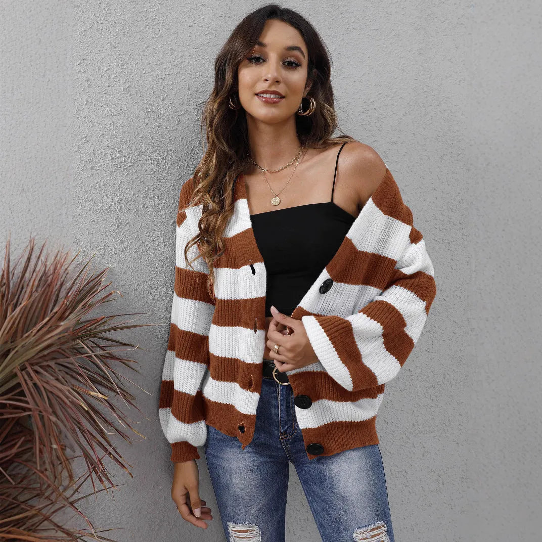 Women's striped cardigan sweater in deer plush polyester fabric on a hanger.