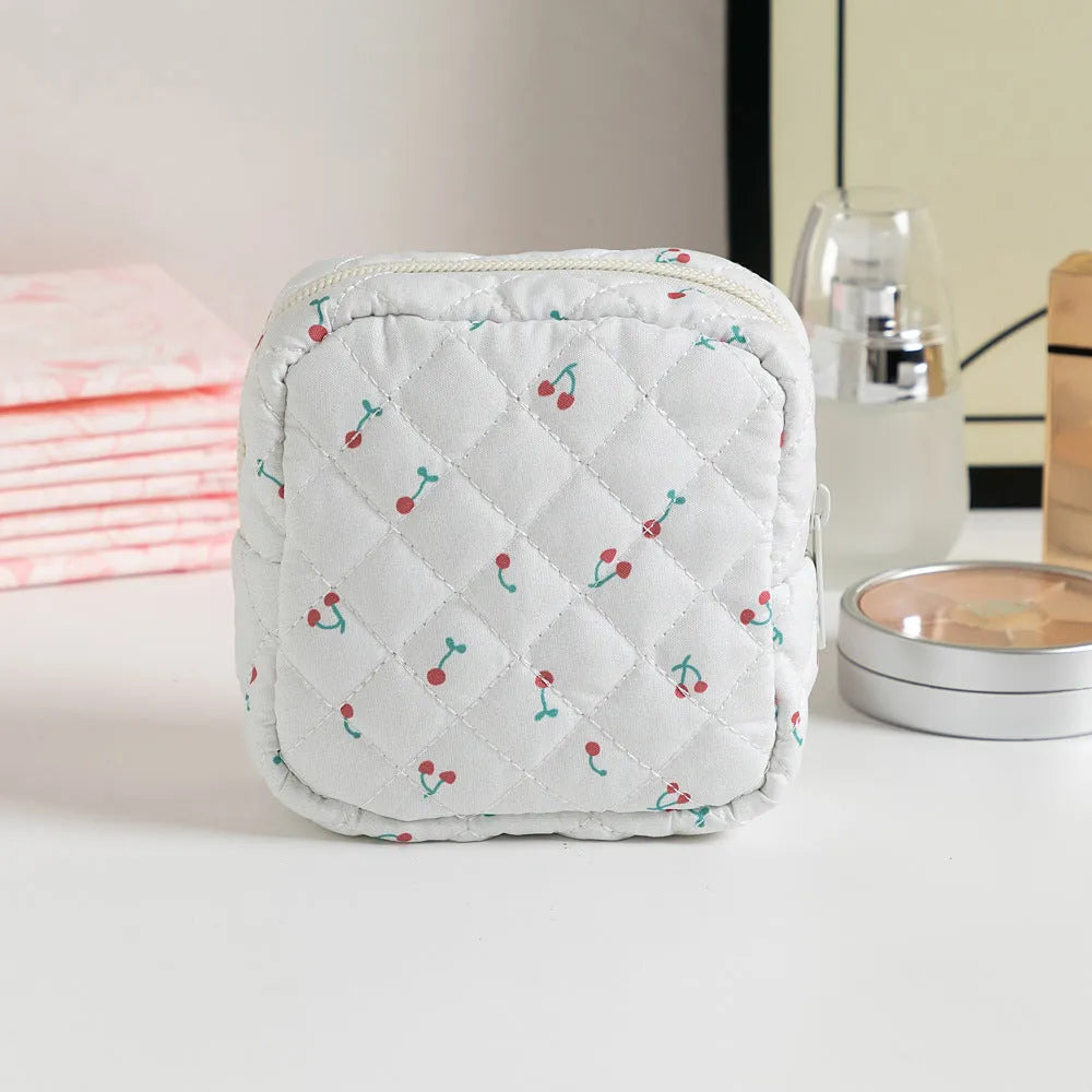 Cute Change women's polyester key storage bag in a floral pattern with sewing thread detail.