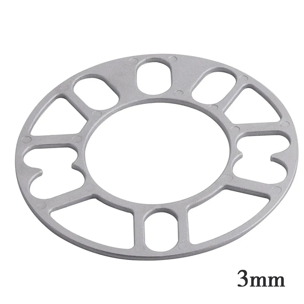 A metallic wheel hub widening gasket or spacer in various thicknesses for automotive modification.