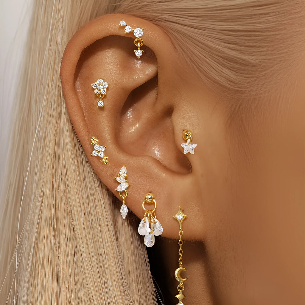 S925 sterling silver geometric moon and star earrings in a gold colour on a white background
