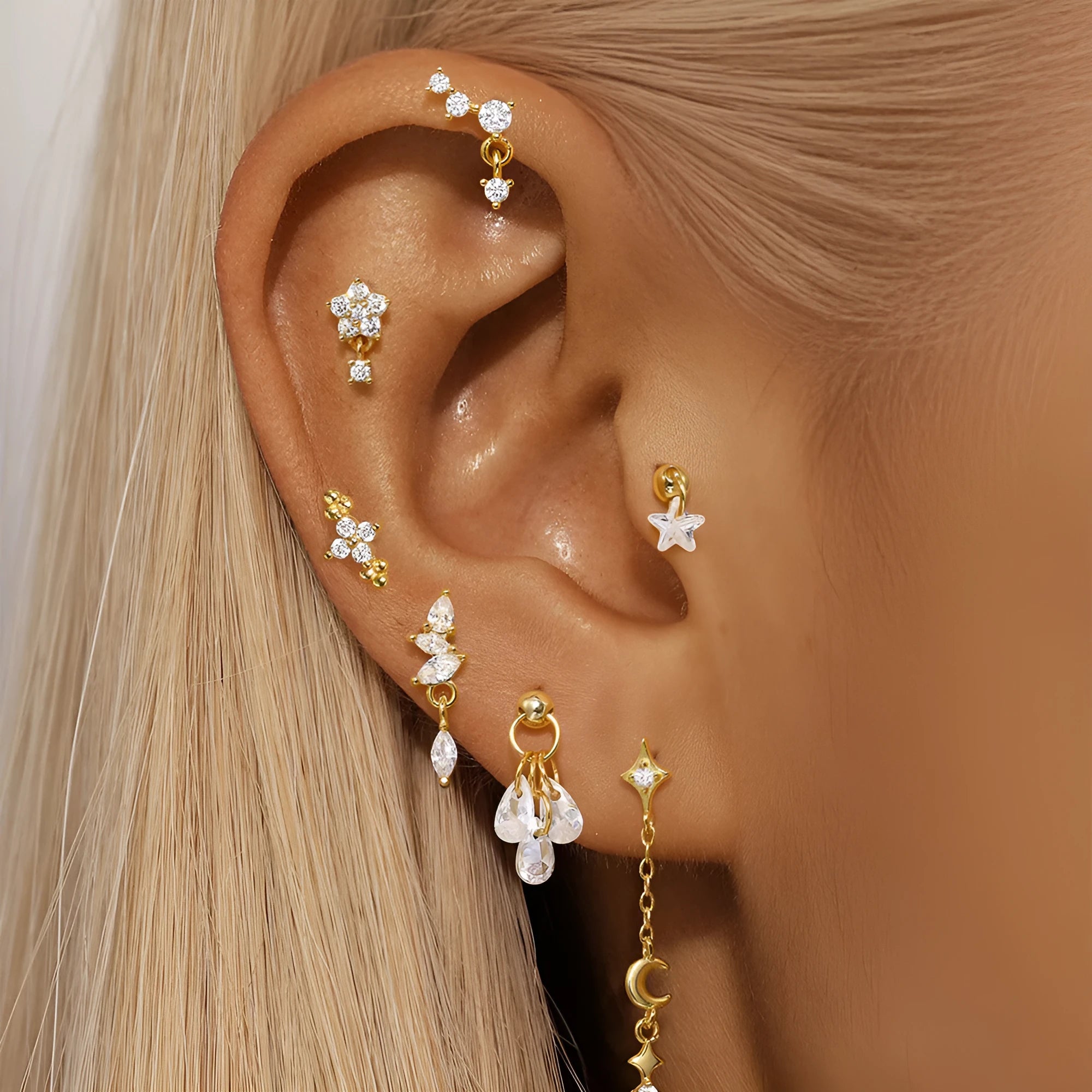 S925 sterling silver geometric moon and star earrings in a gold colour on a white background