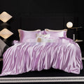 Silk bed sheet four-piece set in modern solid colours showing multiple size options for UK beds