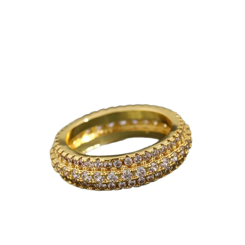 Geometric copper ring with triangle design and zircon stone inlay, shown in a choice of metallic finishes.