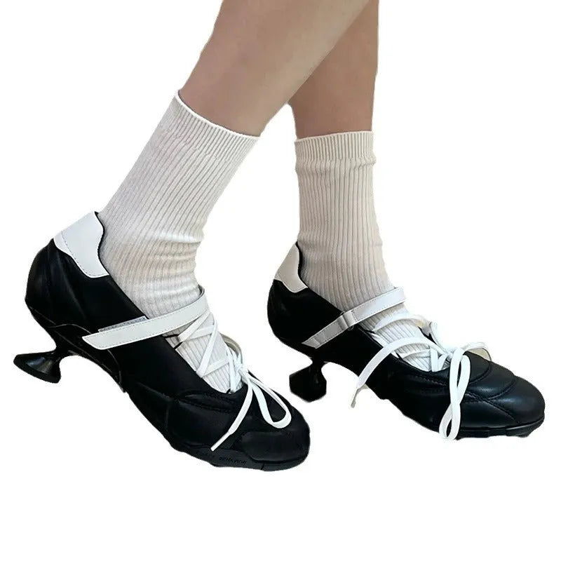 Women's silver lace-up sports-style heeled shoe with a bow detail and round toe.
