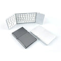 Black tri-fold Bluetooth keyboard shown folded to 30.2cm portable size next to smartphone