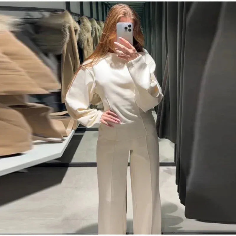 Women's black polar fleece suit set with pleated O-neck long sleeve top and wide leg trousers