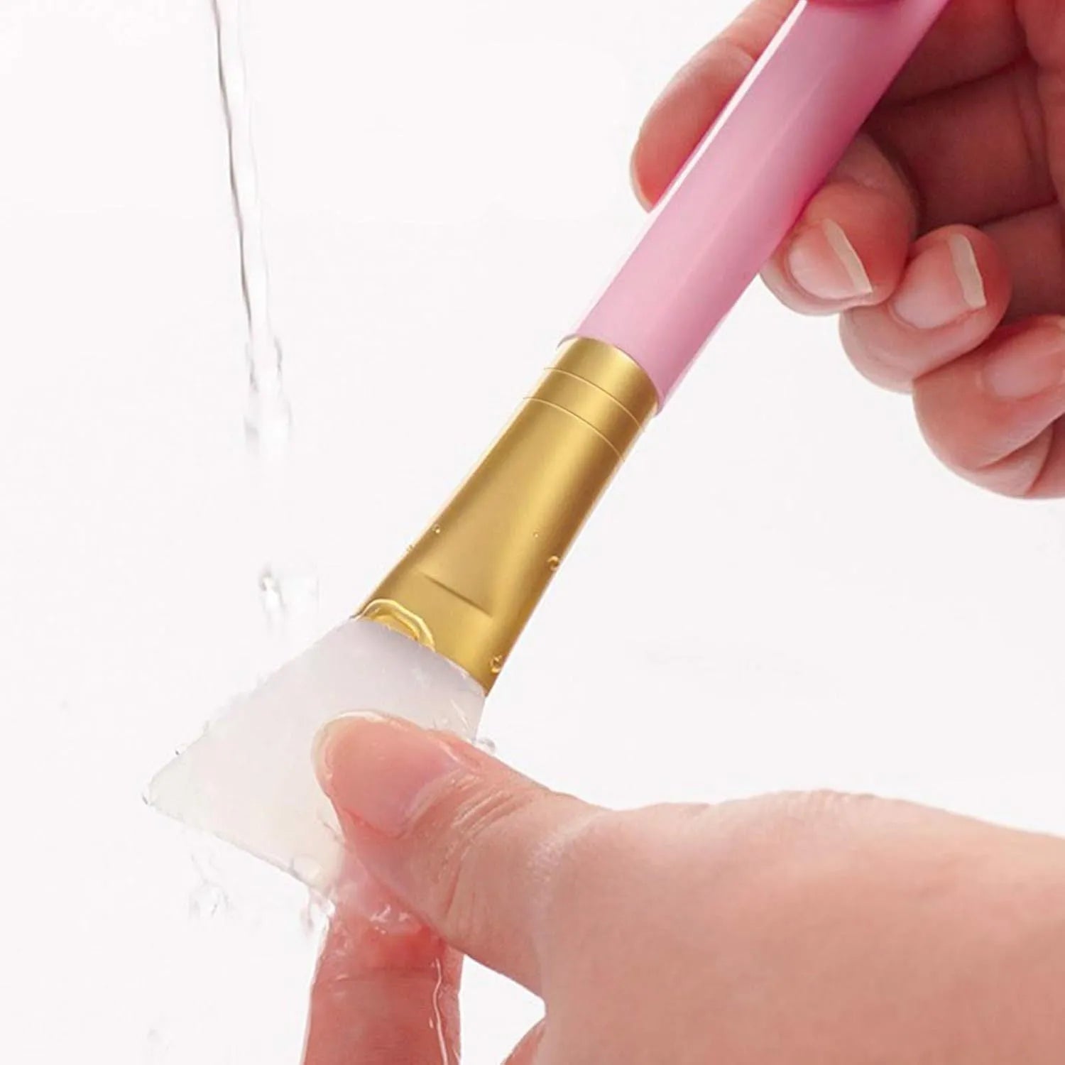 Reusable silicone face mask applicator spatula in six colour options on a clean surface