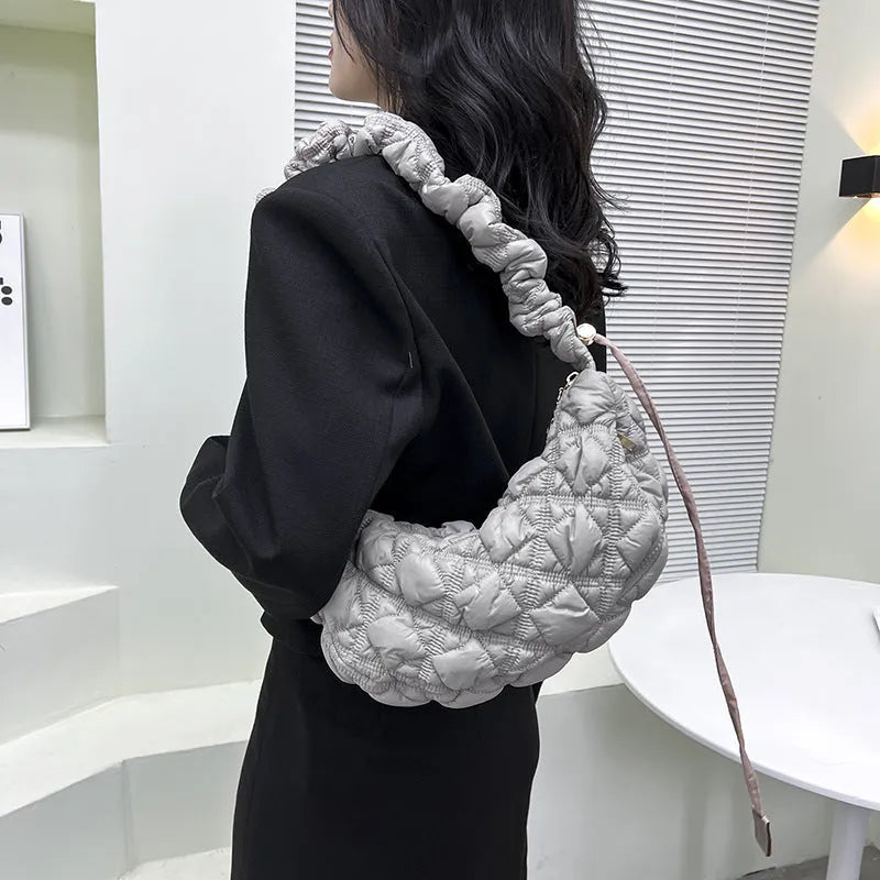 Women's nylon messenger bag in a solid colour with adjustable shoulder strap showing 35cm width.