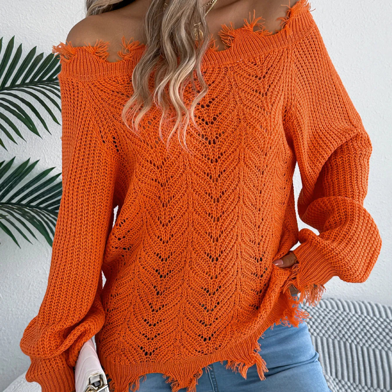 Cut off-the-shoulder acrylic sweater with hollow-out detailing in black, orange, and white colour options