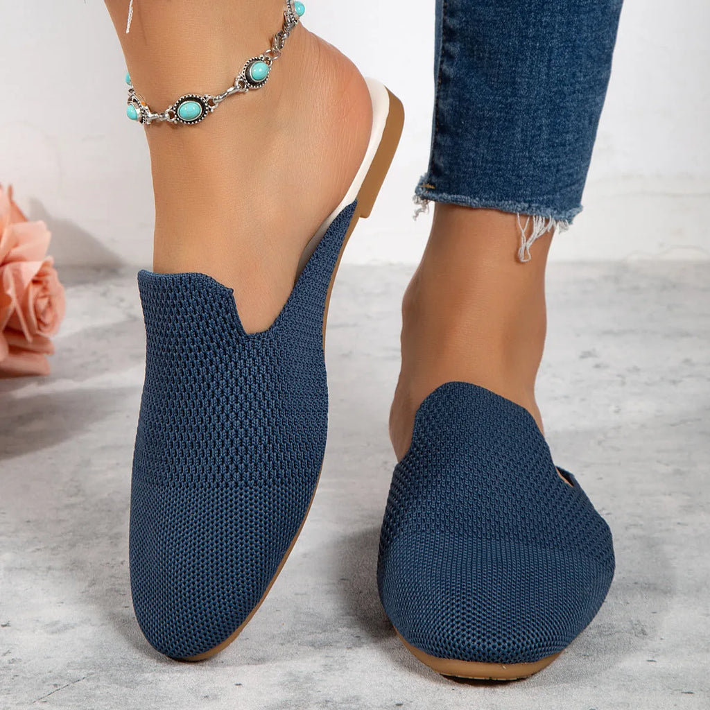 Pair of apricot-coloured mesh slip-on sandals with round toes and a flat rubber sole.