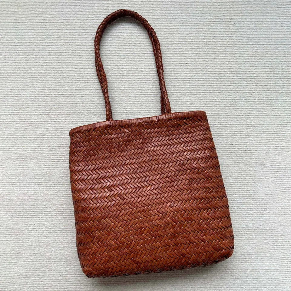 Handmade brown woven leather tote bag with three-dimensional pocket and shoulder strap