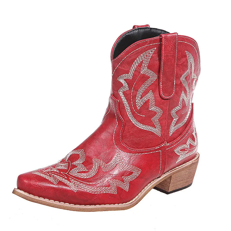 Women's blue embroidered cowboy boots with wedge heel and pointed toe on a white background.
