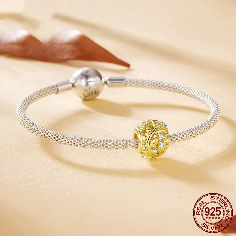 S925 sterling silver plated 14k golden leaf bead with 0.45cm aperture on white background