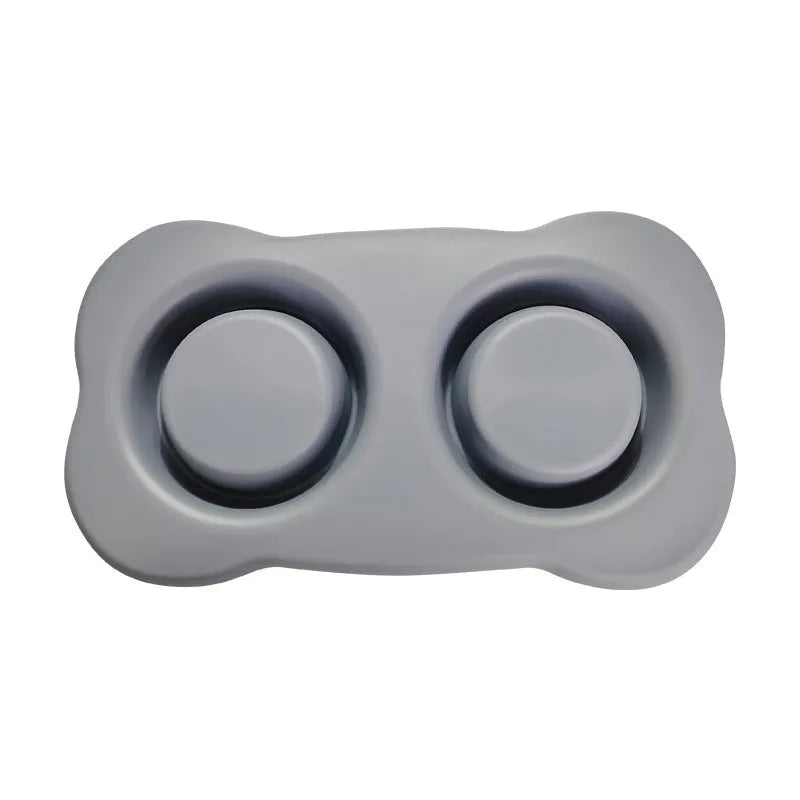 Large silicone double dog bowl with stainless steel inserts in raised feeding design