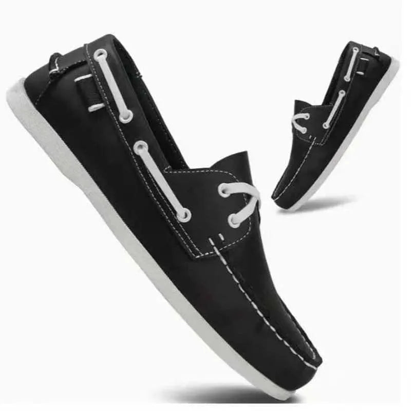 Men's black casual shoes with round toe, flat heel, and lace-up design on a white background.