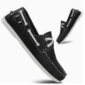 Men's black casual shoes with round toe, flat heel, and lace-up design on a white background.