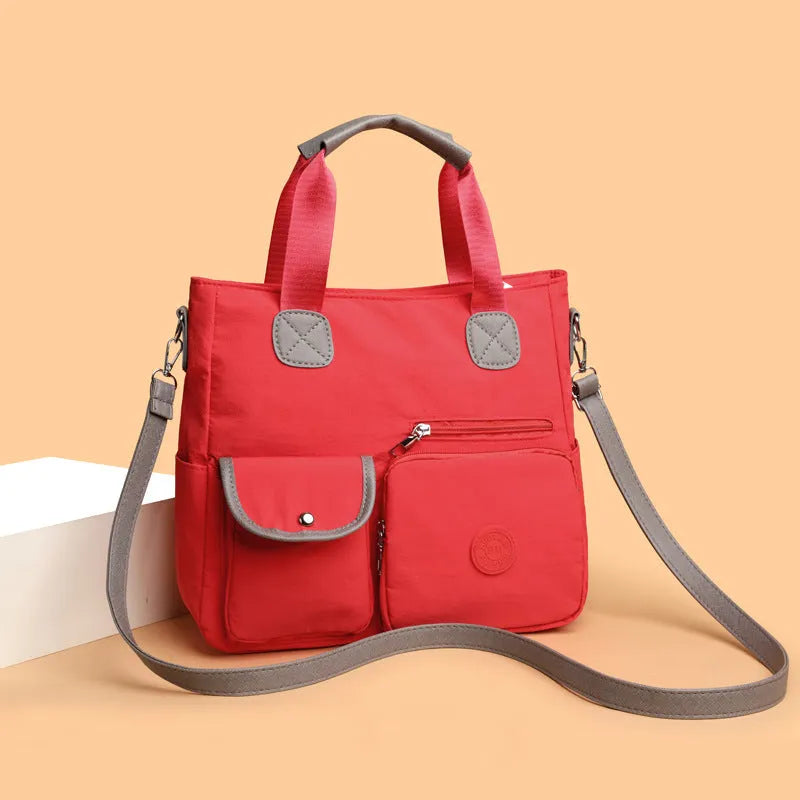 Women's nylon large-capacity crossbody bag in black with organised compartments and single shoulder strap