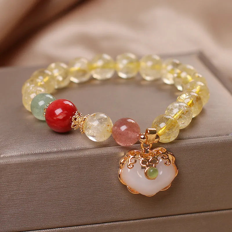 Women's alloy bracelet with a yellow citrine jade ruyi pendant charm.