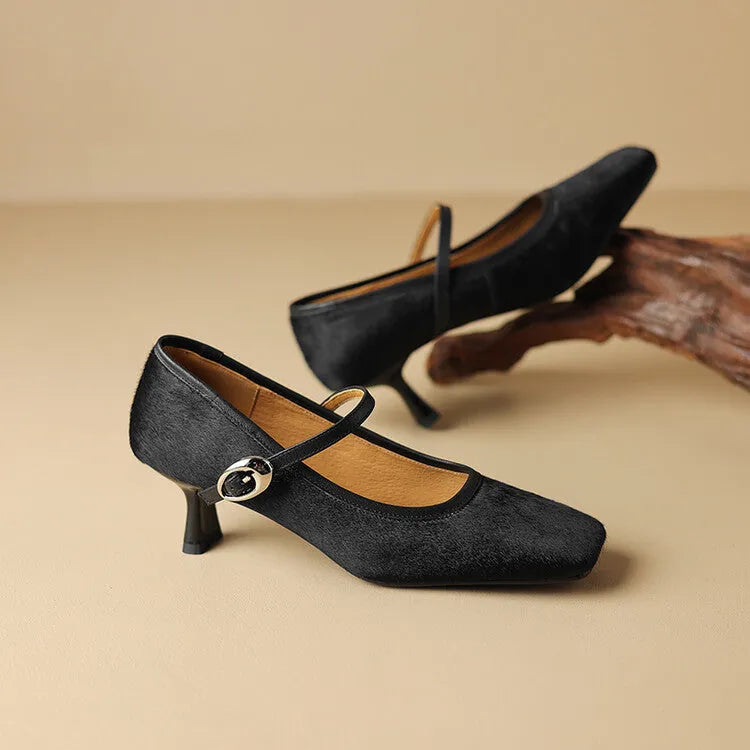 Women's black square toe stiletto ankle-strap shoes with horse hair upper and buckle fastening.