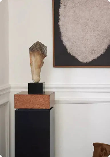 Carved abstract horse head sculpture in retro French style on a desktop.