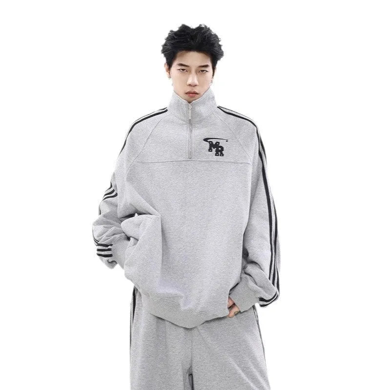 Black retro sports hoodie with a stand collar and long sleeves, shown on a model.