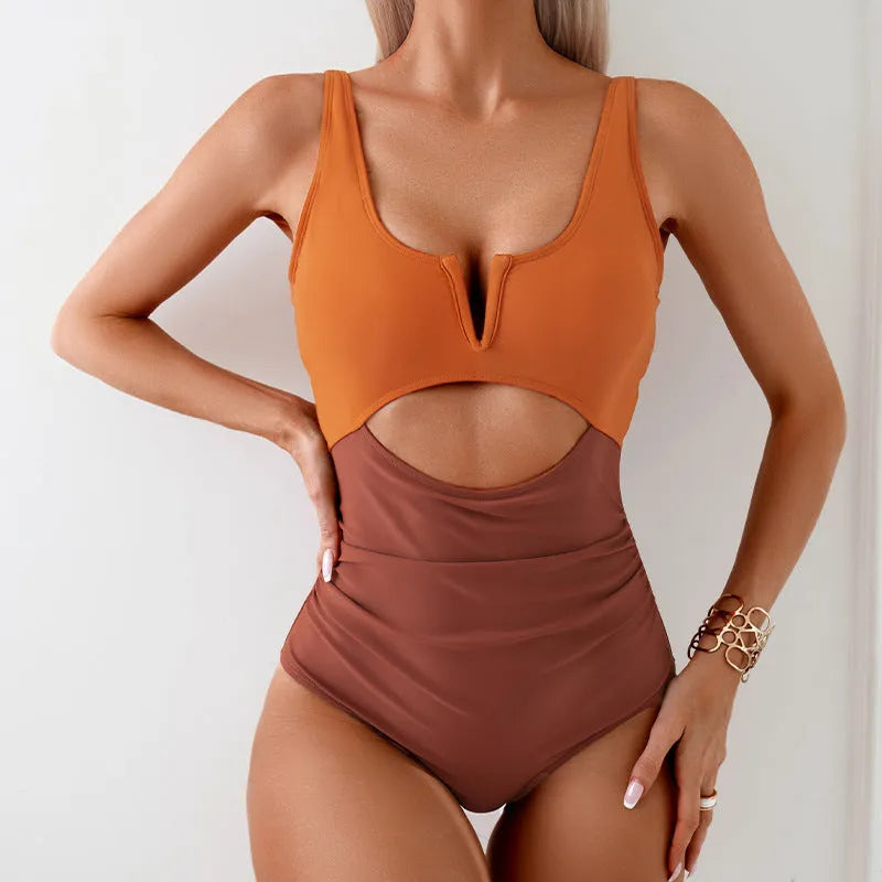 Women's one-piece nylon swimsuit in contrasting colours showing front design