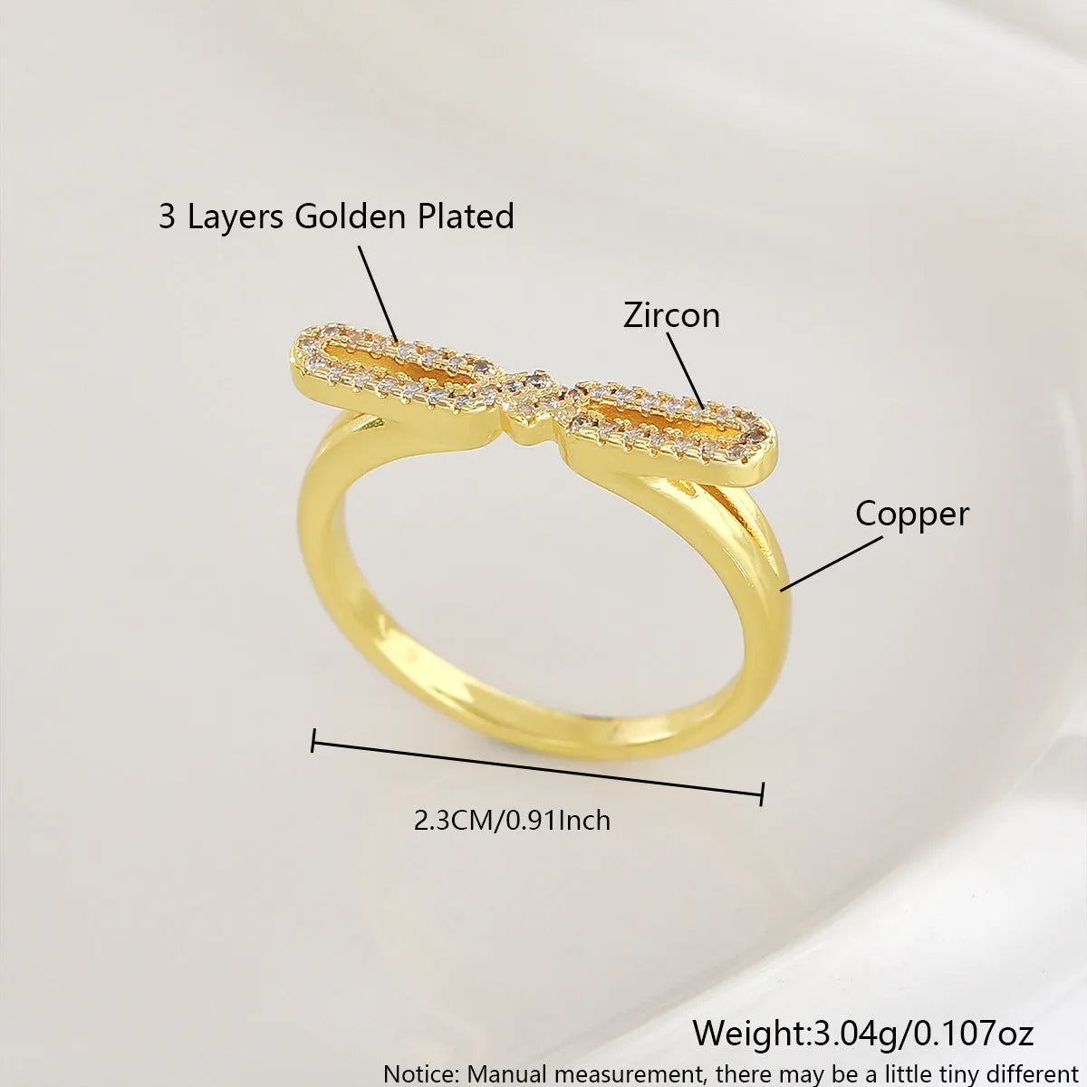 Fashion bowknot ring for women, copper with electroplated gold finish, bow shape on white background