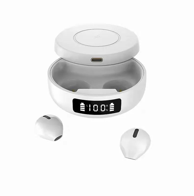 Mini black and white semi-in-ear wireless headphones sitting in their open wireless charging case.