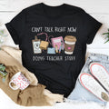 Black loose fit cotton T-shirt with short sleeves and round neck on hanger